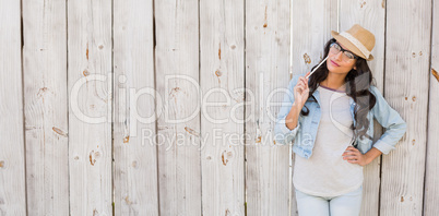 Pretty brunette thinking and smiling