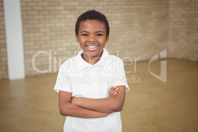 Happy pupil with folded arms