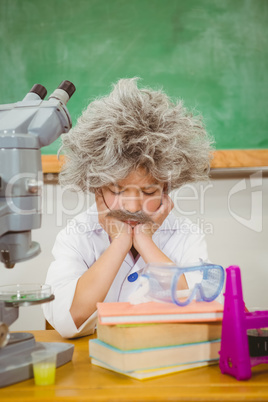 Student dressed up as einstein using a chemistry set