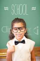 School against cute pupil dressed up as teacher in classroom