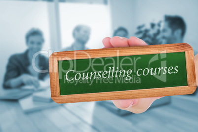 Counselling courses against group of colleagues reading books