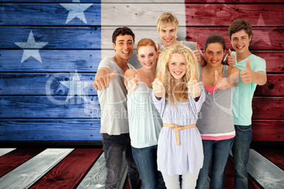 Composite image of group of teenagers standing in front of the c