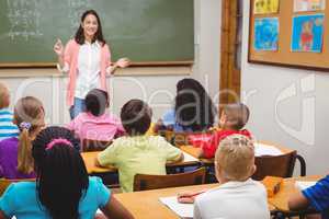 Teacher teaching her classroom of students