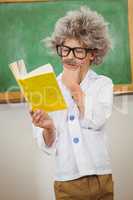 Student dressed up as einstein reading a book