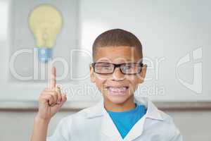 Smiling pupil with lab coat having an idea