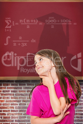 Composite image of cute little girl thinking and looking up