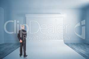 Composite image of rear view of mature businessman posing
