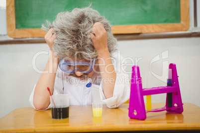 Student dressed up as einstein using a chemistry set