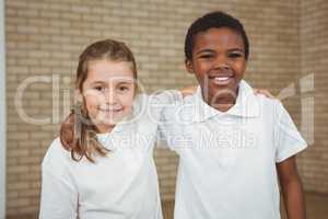 Pupils smiling with arms around each other