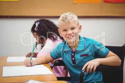 Smiling student sitting in wheelchair