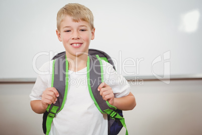 Smiling student wearing a school bag