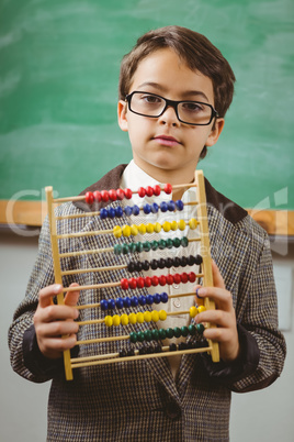 Pupil dressed up as teacher holding abacus