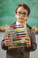 Pupil dressed up as teacher holding abacus