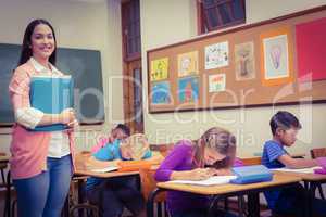 Teacher standing by her students