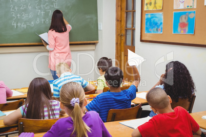 Student about to throw a paper airplane