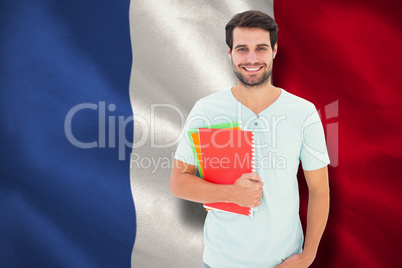 Composite image of student holding notepad