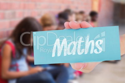 Maths against cute pupils using mobile phone