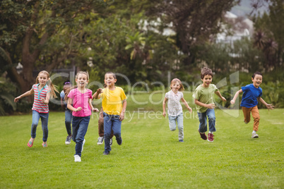 Cute pupils running towards camera