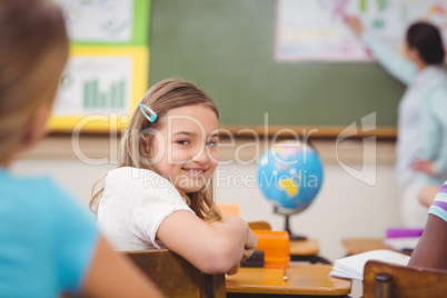 Pupil smiling at camera during class