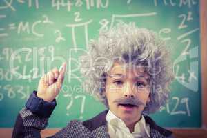 Little Einstein having an idea in front of chalkboard