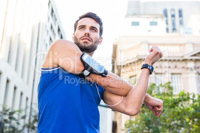 Handsome athlete warming up