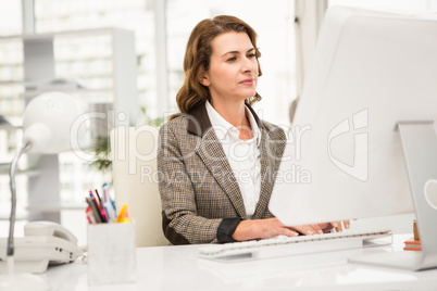 Casual businesswoman working with computer