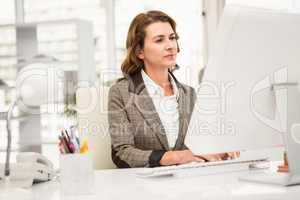 Casual businesswoman working with computer