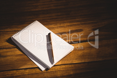 View of a notepad with pen