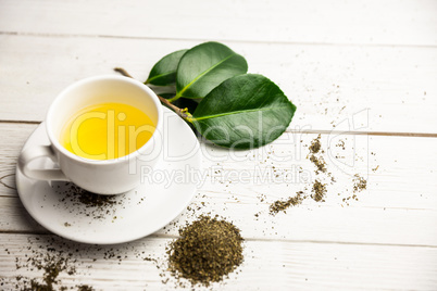 Cup of herbal tea on table