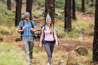Young happy hiker couple hiking