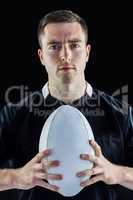 Rugby player holding a rugby ball