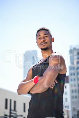 Portrait of an handsome athlete with arm crossed
