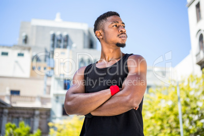 A handsome athlete arm crossed