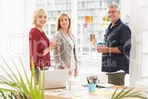 Standing business team looking at the camera