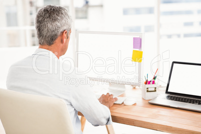 Casual businessman working with computer