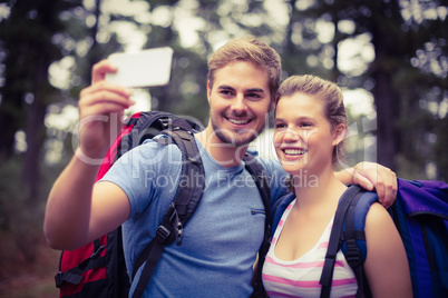 Young happy hikers taking a selfie