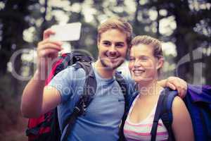 Young happy hikers taking a selfie