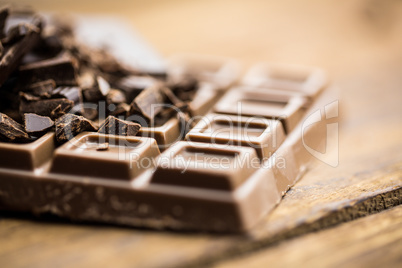 Dark and milk chocolate on a wooden table