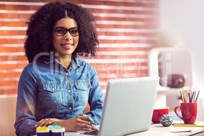 Portrait of a casual businesswoman at her desk Portrait of a casual businesswoman at her desk