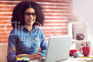 Portrait of a casual businesswoman at her desk