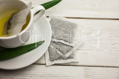 Cup of herbal tea on table