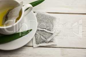 Cup of herbal tea on table