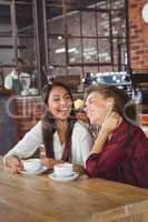 Female friends having coffee