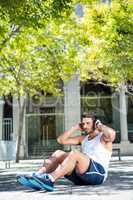 Handsome athlete doing sit ups