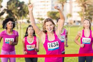 Cheering blonde winning breast cancer marathon