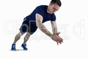 A fit man doing clapping hands push ups