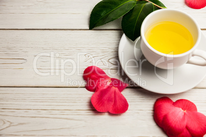 Cup of herbal tea on table