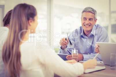 Smiling businessman talking while meeting