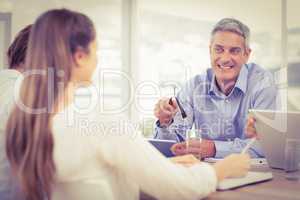 Smiling businessman talking while meeting