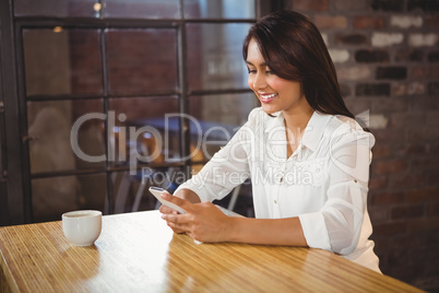 Casual businesswoman using her phones